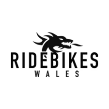 Ridebikes Wales logo featuring a stylized dragon head above the text.