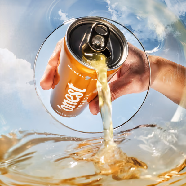 A cinematic shot of a can pouring into a glass