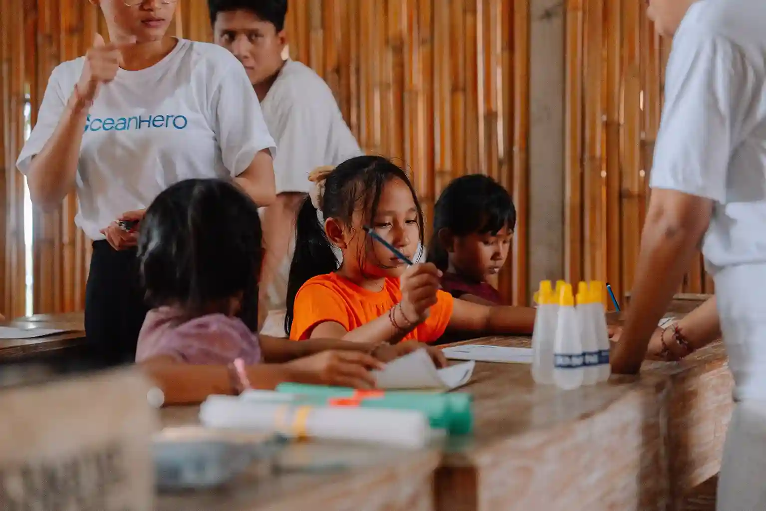 OceanHero volunteers guiding children in a hands-on ocean conservation activity at Sekolah Torrevieja