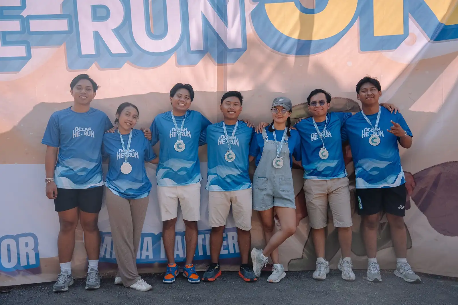 OceanHe-Run participants with their medals at the finish