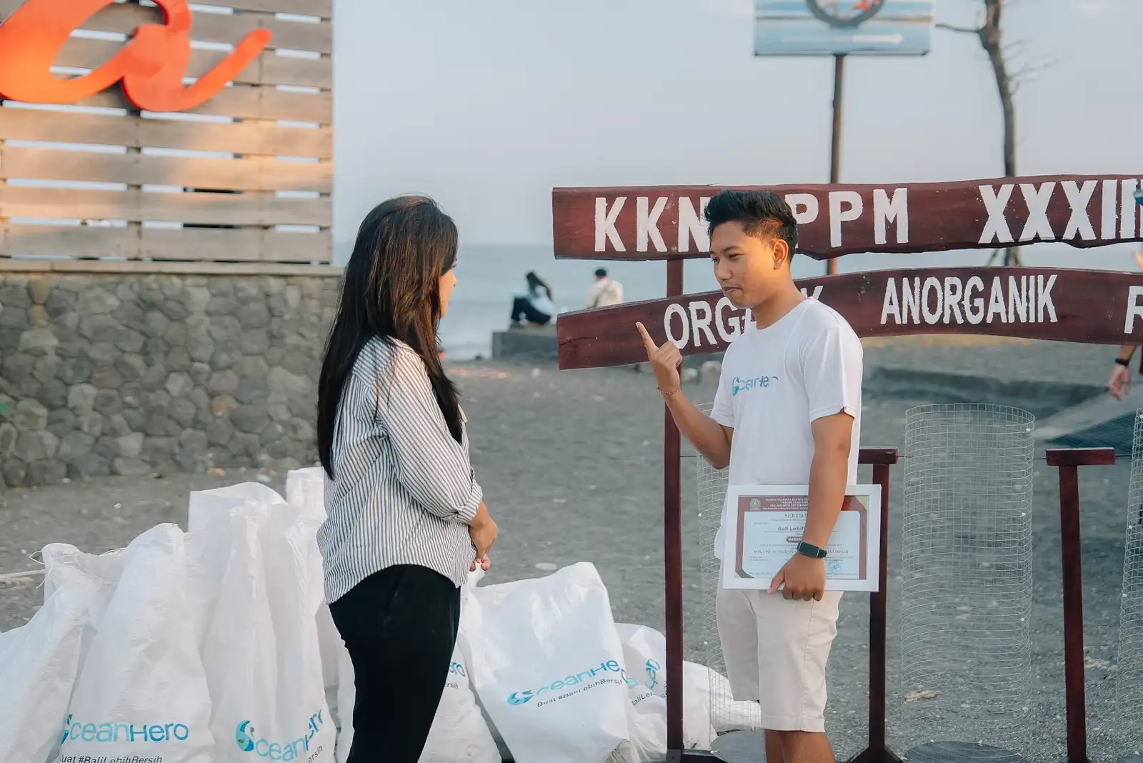 Collected waste sorted into organic and inorganic sacks at Purnama Beach