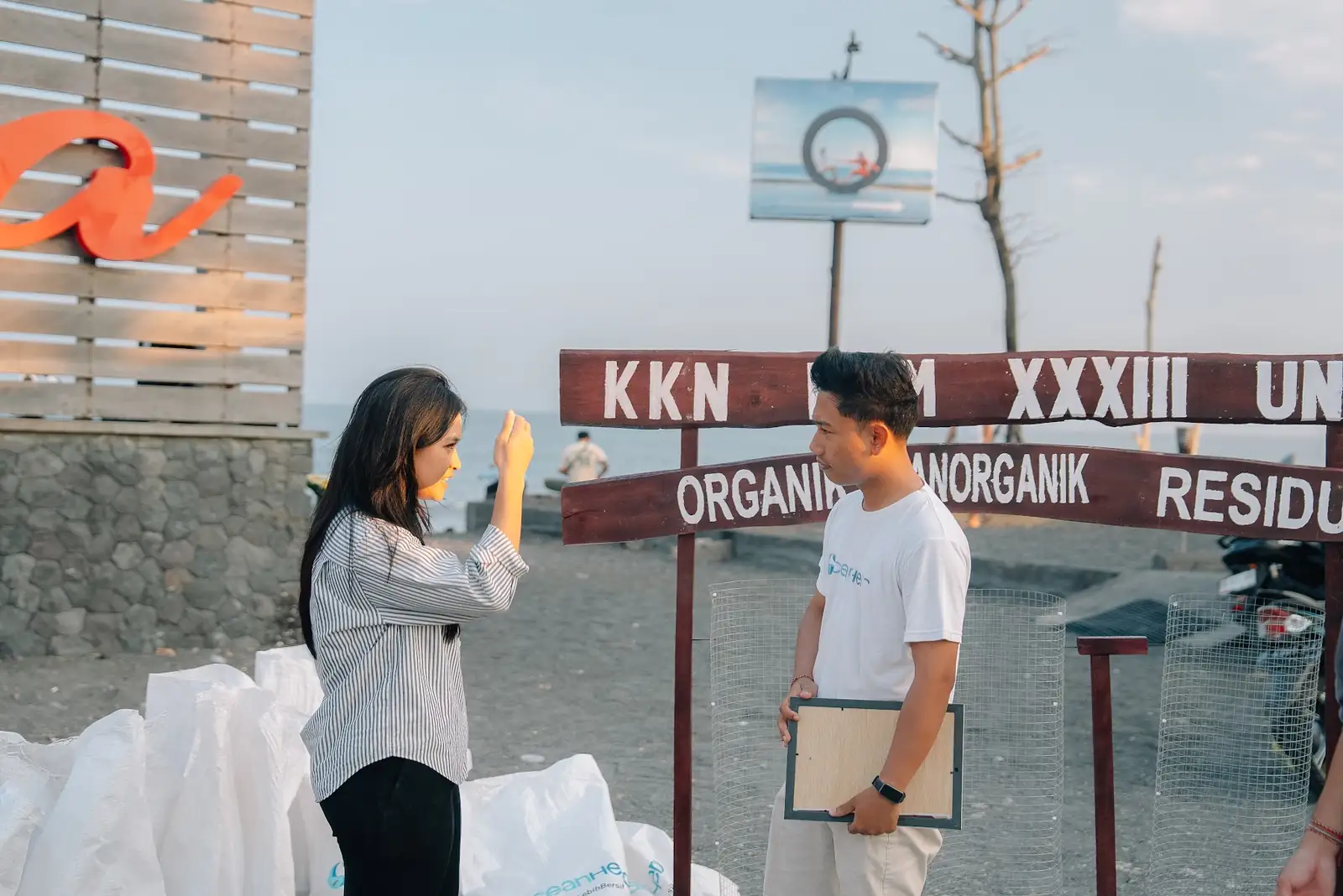 Volunteers weighing and sorting the collected waste at Purnama Beach