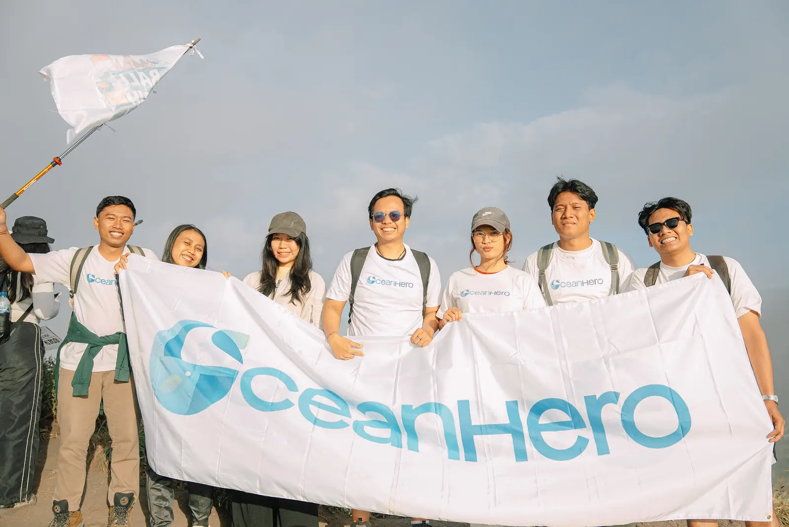 OceanHero volunteers with the campaign banner at the summit of Mount Batur