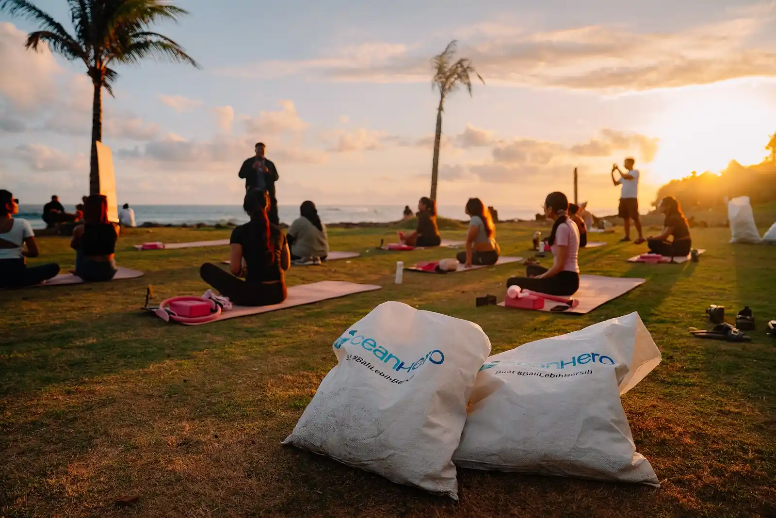 Collected OceanHero waste sacks beside the Pilates mats at Seseh Beach