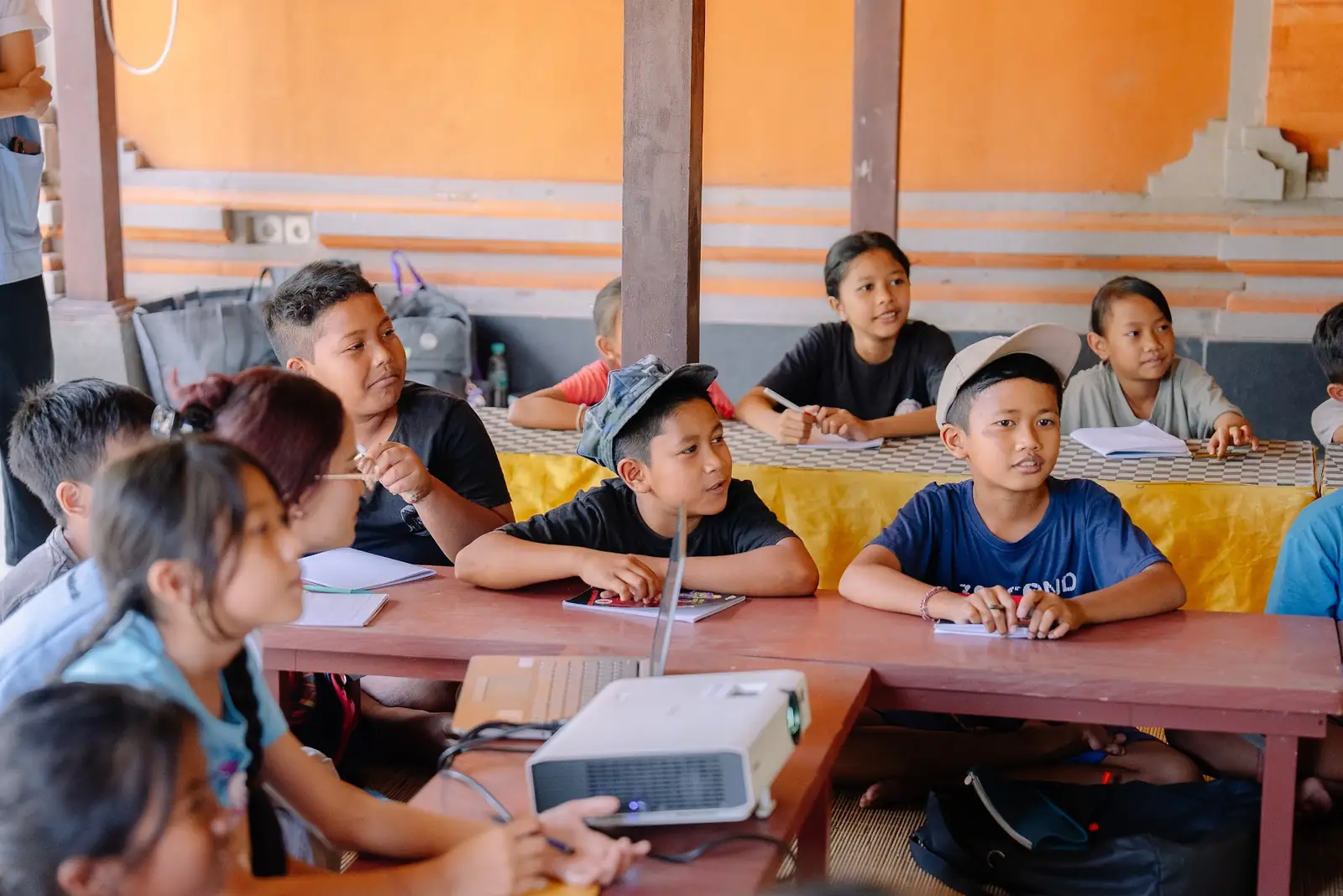 Children at their desks during the session at Rumah Belajar Sentir
