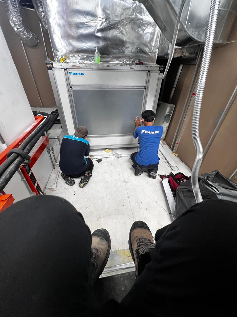 Aircond technician performing chemical wash service