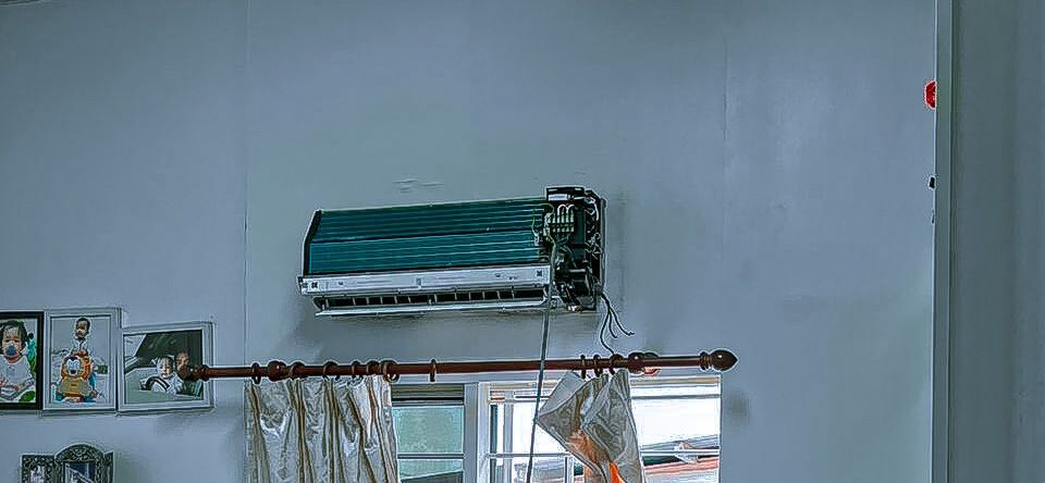 Wall mounted aircond unit opened for servicing in Semenyih