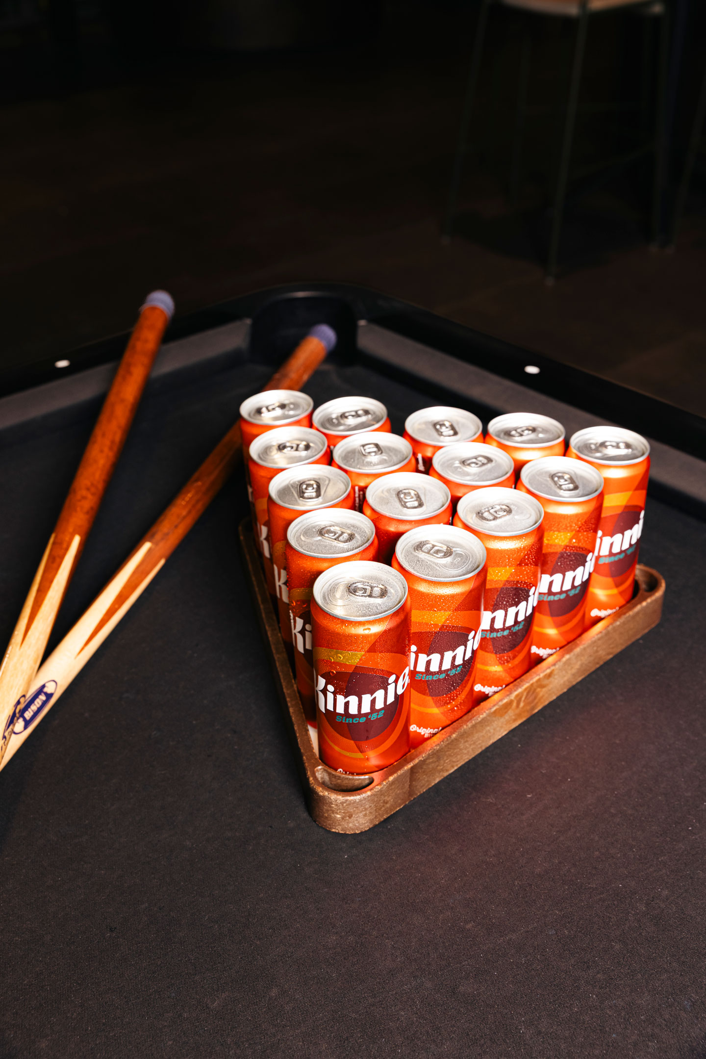 Kinnie cans on a biliard table
