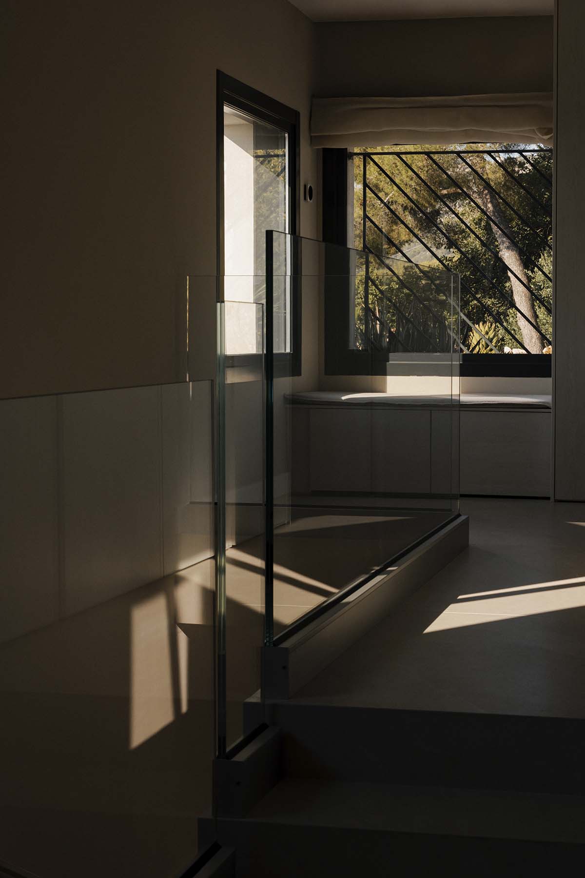 Villa interior overlooking the garden through large windows