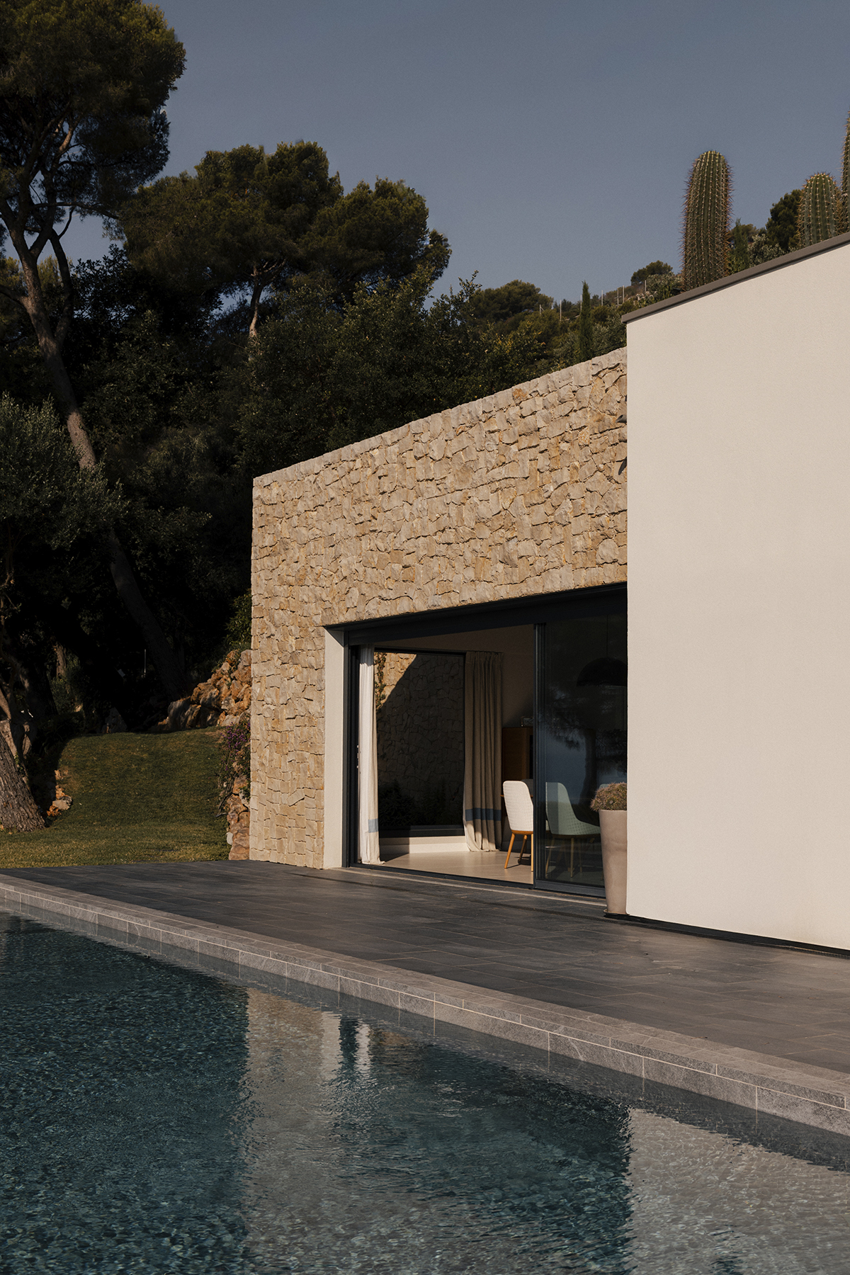 Outdoor swimming pool alongside the contemporary villa