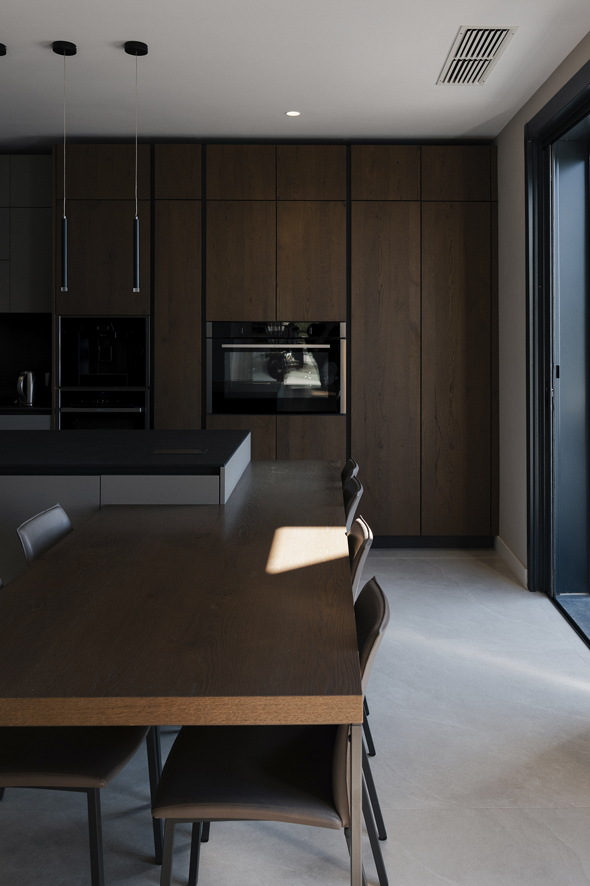 Villa interior with wooden kitchen and living area