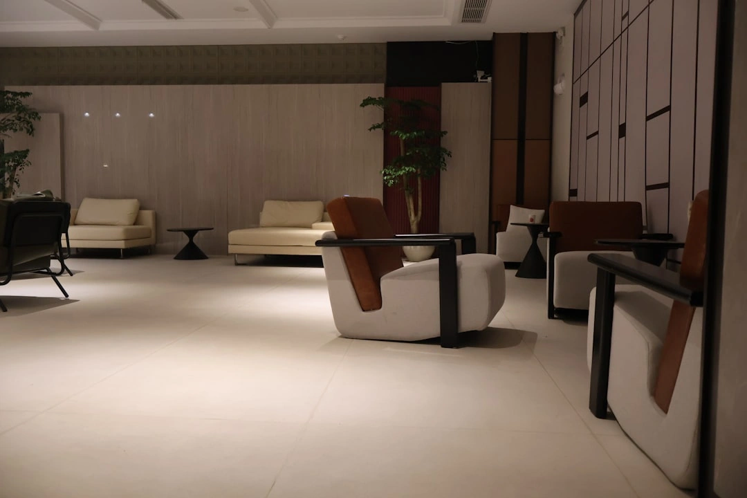 A modern office lounge with comfortable seating and natural light A modern office lounge with comfortable seating and natural light