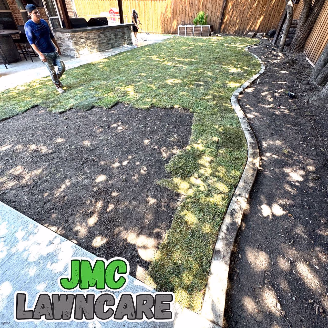 Professional landscaping and flower bed cleanup by JMC Lawn Care