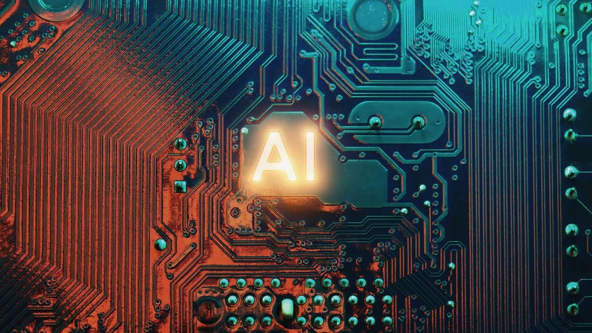 Un circuit imprimé avec les lettres "AI" illuminées au centre, représentant les technologies de l'intelligence artificielle et la question de comment investir dans ce domaine.