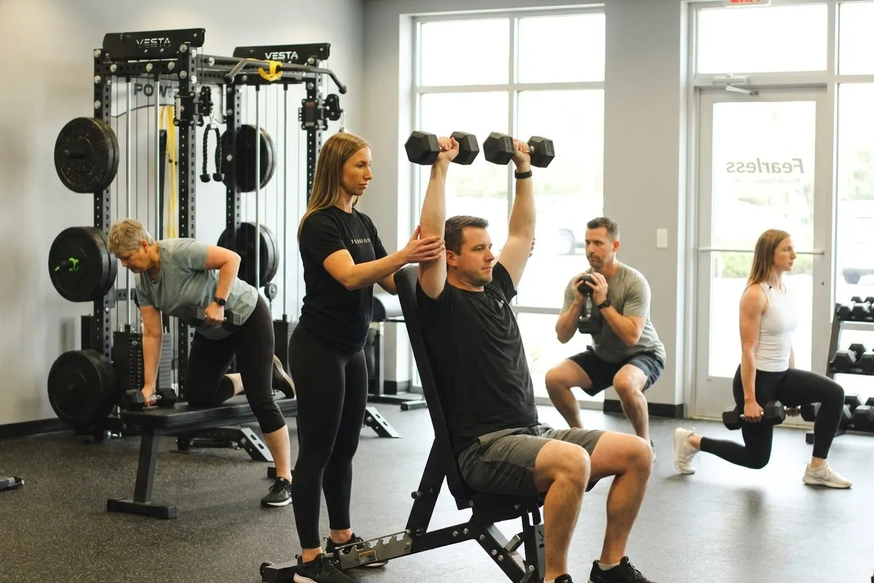 Patient working with a provider at a physical therapy clinic in Rogers, MN during a functional movement assessment