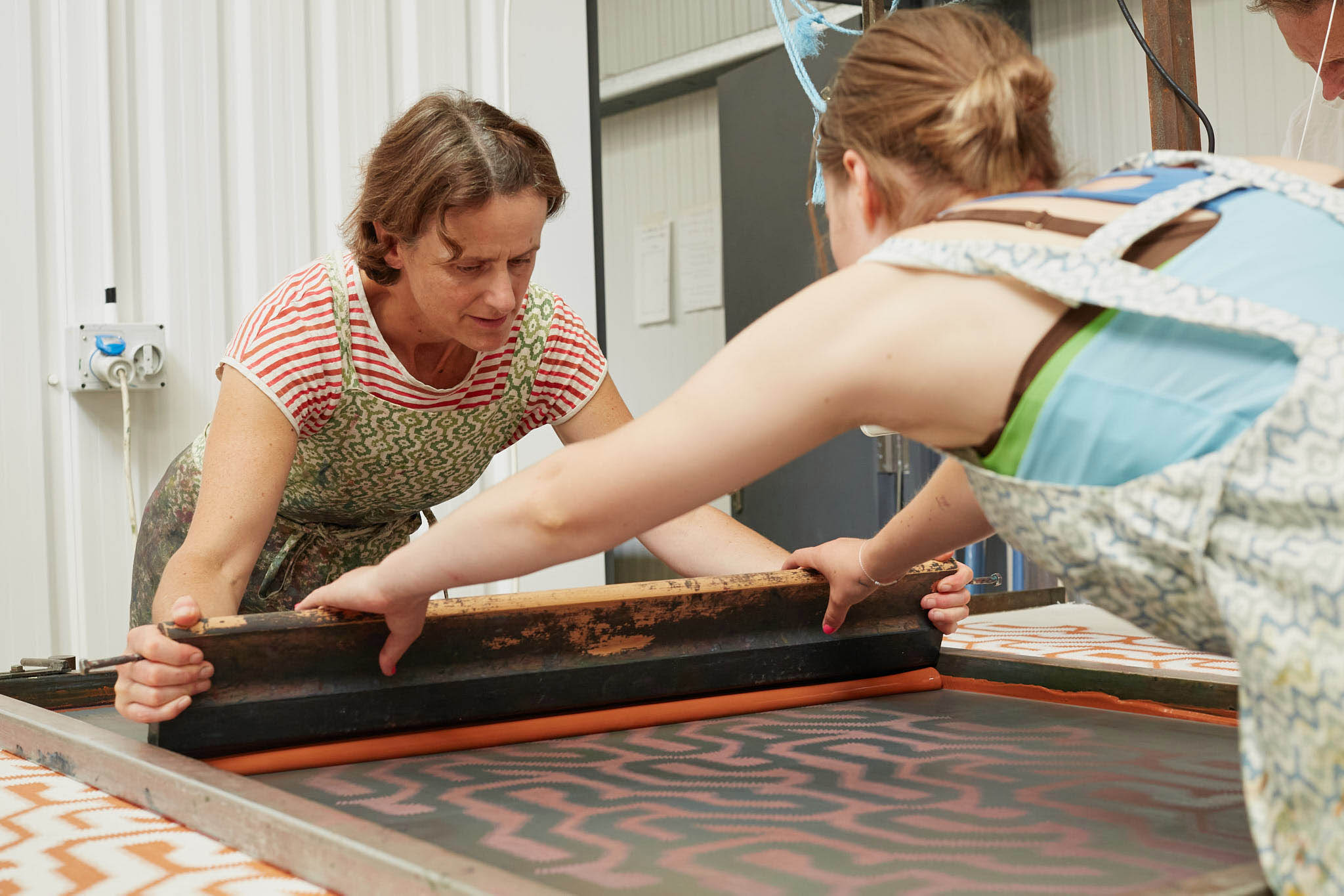 Rapture and Wright two women working silk screen printing 