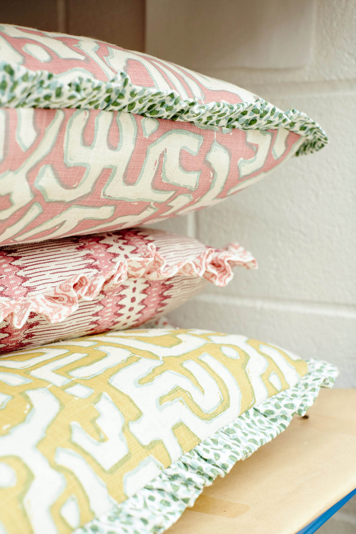 Rapture and Wright stack of three cushions in different fabrics