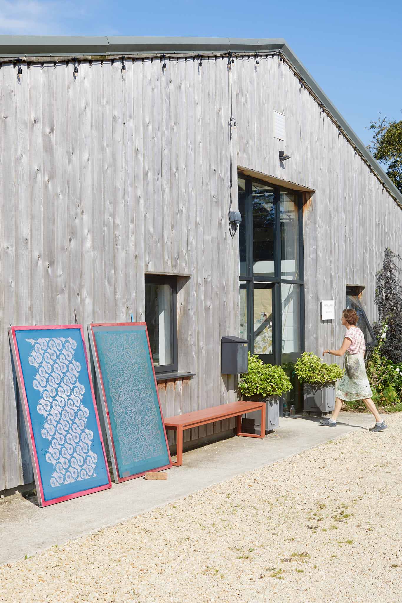 Rapture and Wright two silk screen prints leaning against outside of factory 
