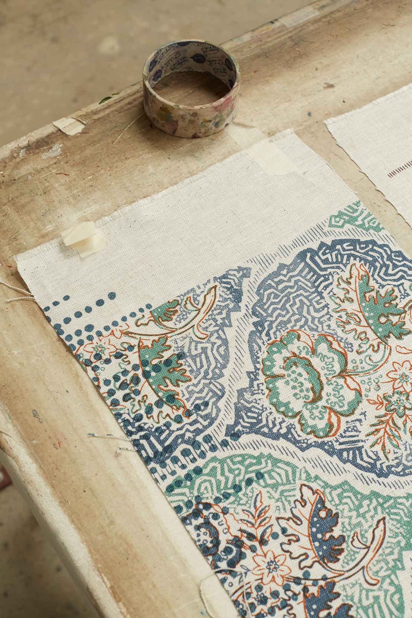 Rapture and Wright small piece of intricate fabric design on table 