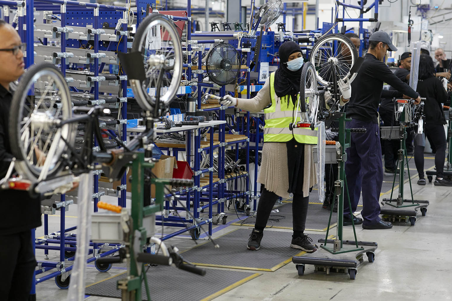 people making bicycles in brompton bicycle factory