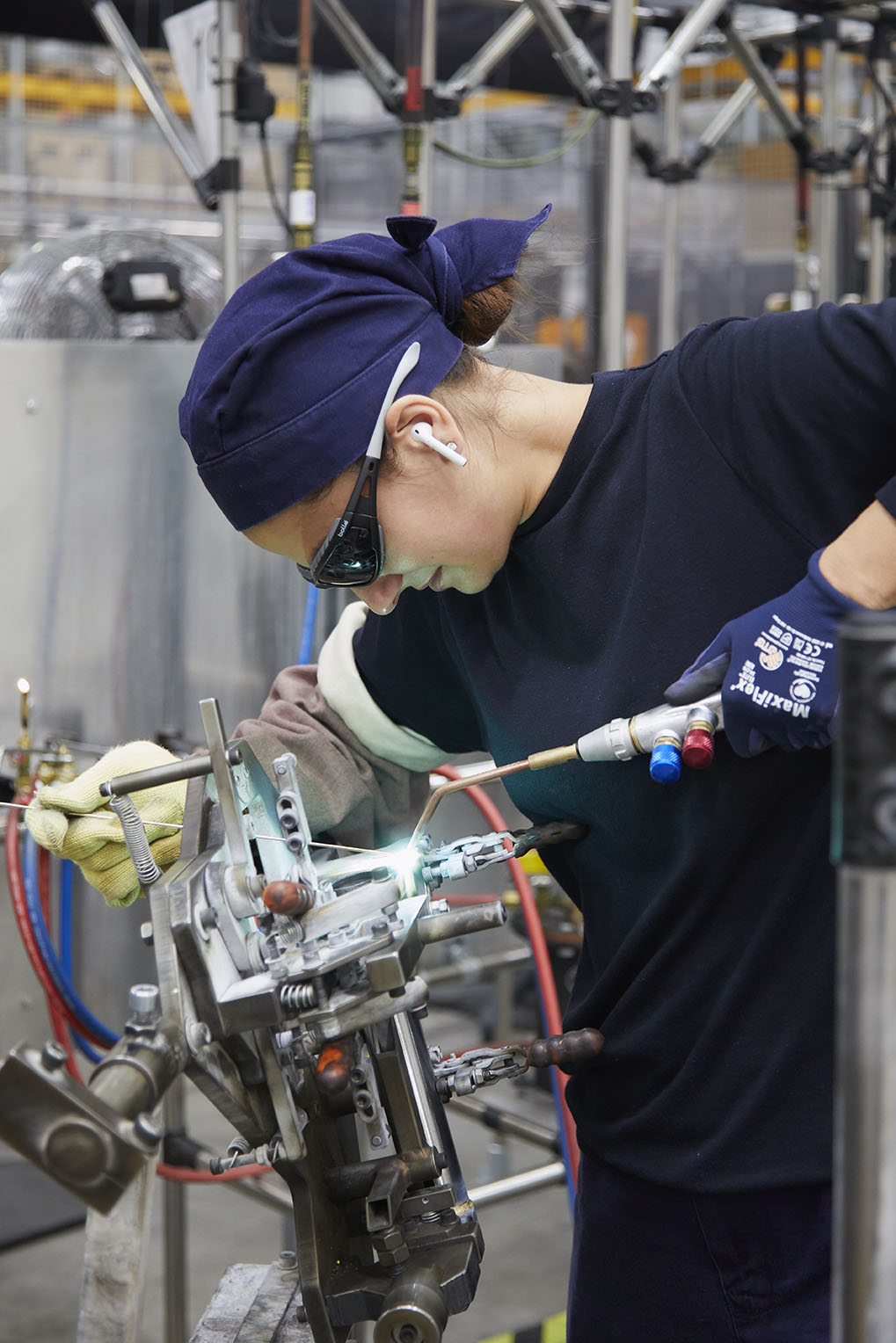 woman working with tools at brompton bicycle factory