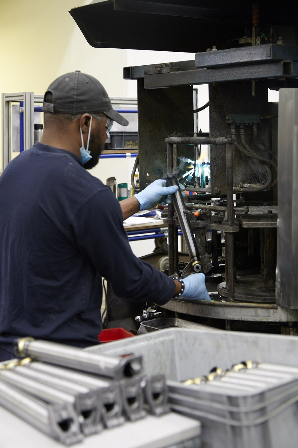man working at machine at brompton bicycle factory
