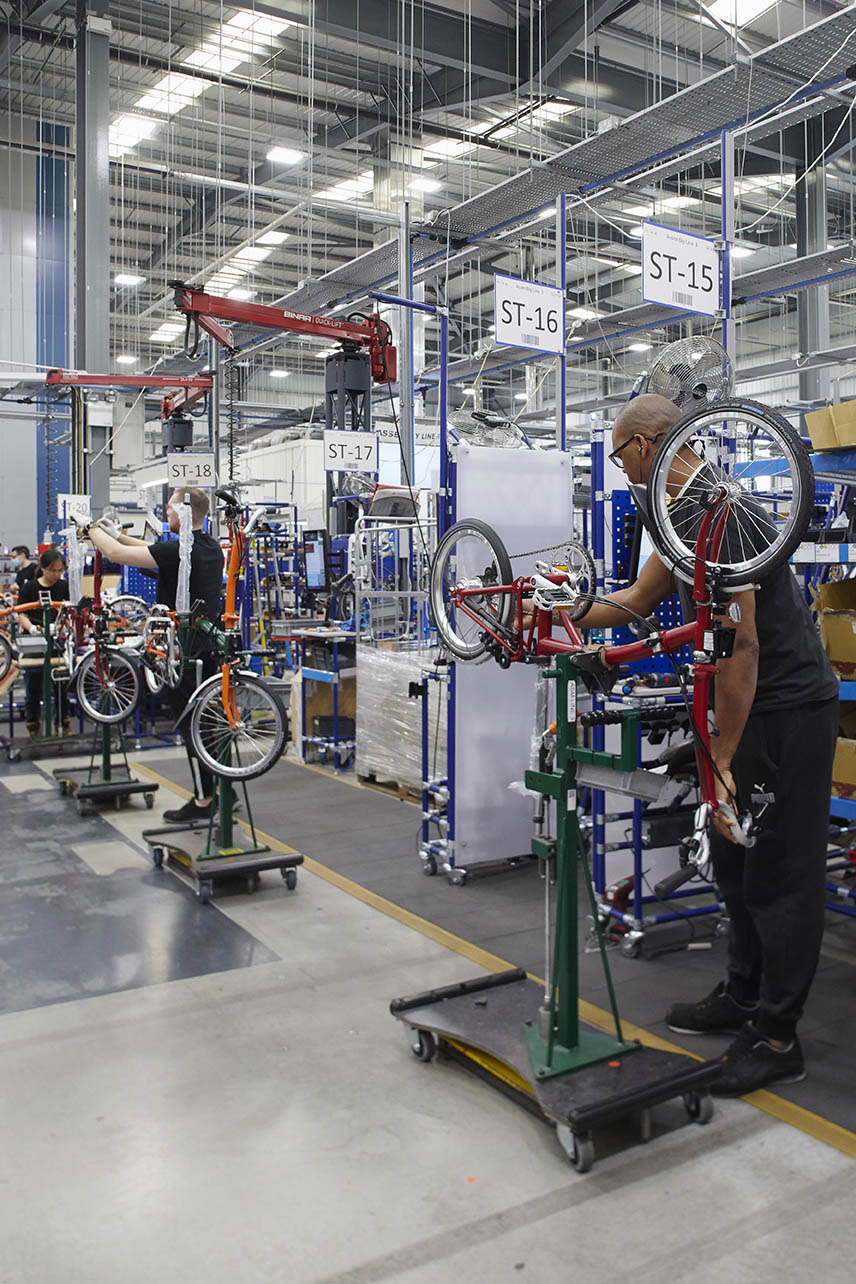 man building a bicycle at brompton bicycle factory