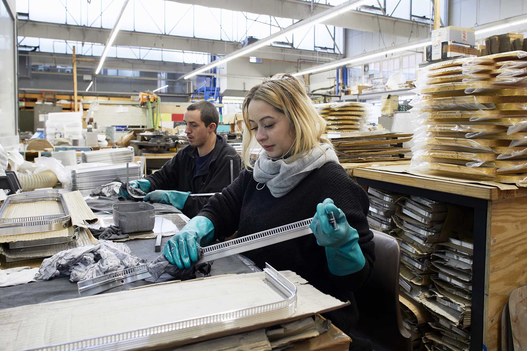 woman working at desk in kaymet factory 