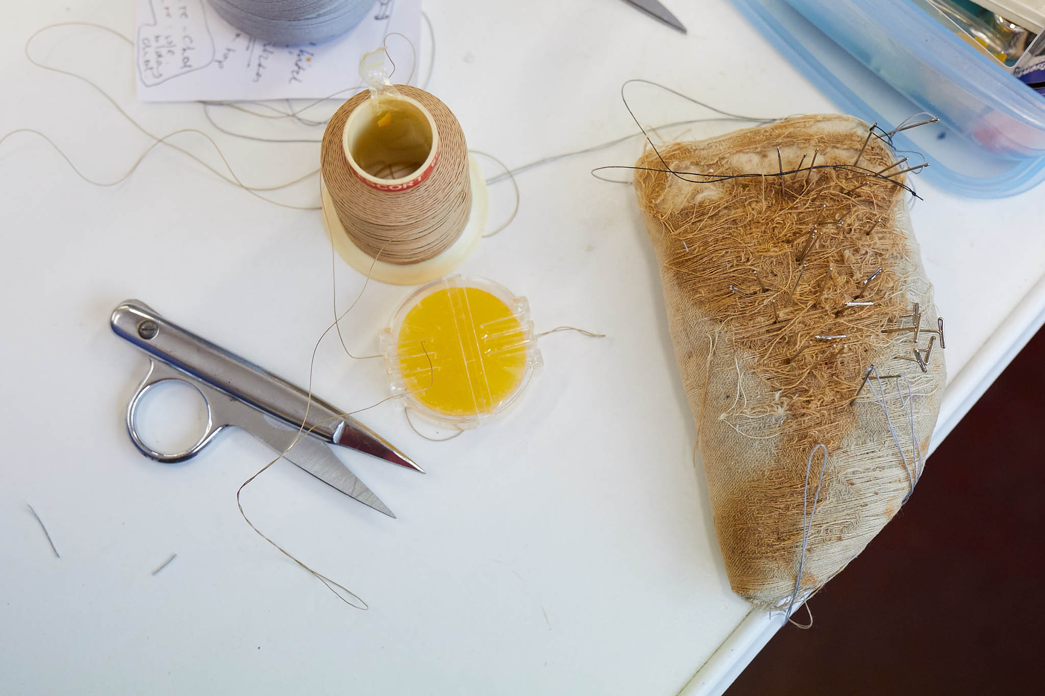 needles thread and speciality scissors on table Ince Umbrellas
