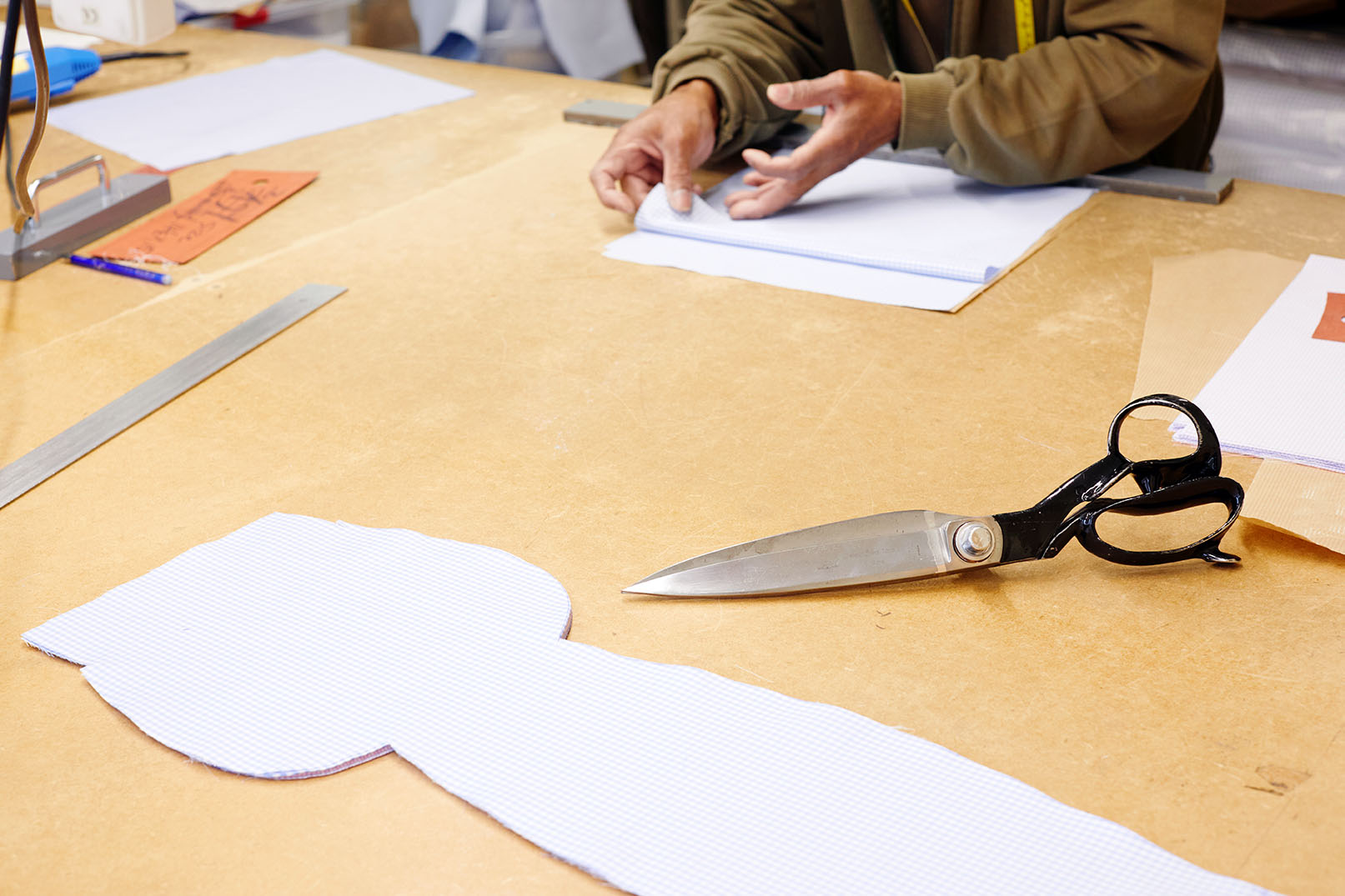 Emma Willis bespoke tailoring patterns on table large fabric scissors
