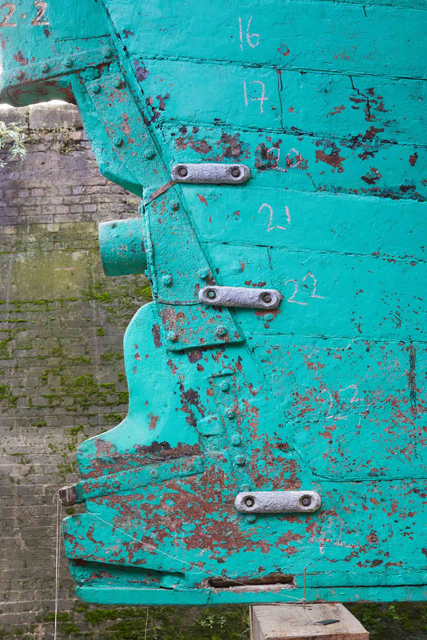 T Nielsen and Co close up of bright blue teal ship hull