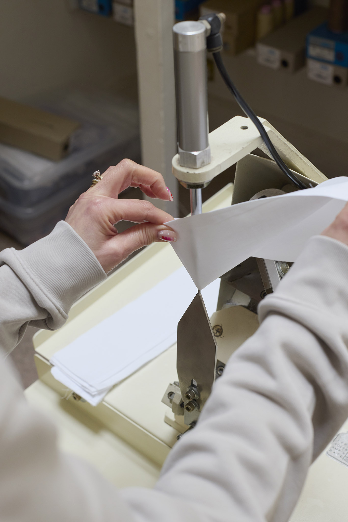 Emma Willis bespoke tailoring close up of hands working at sewing machine