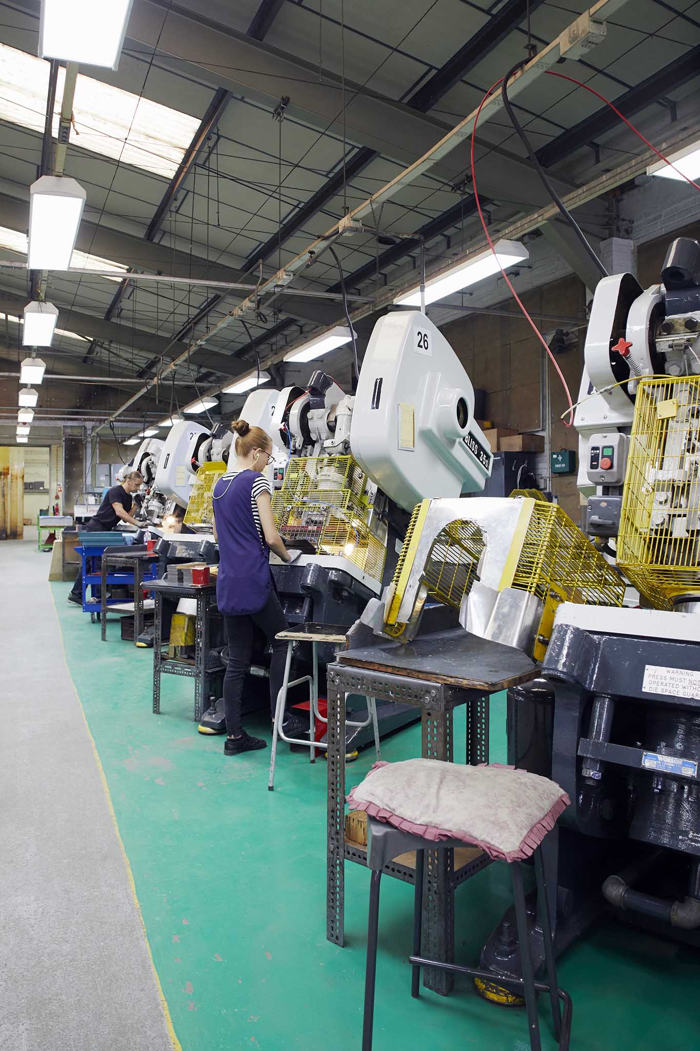 William Say & Co workers working with large machinery on factory floor