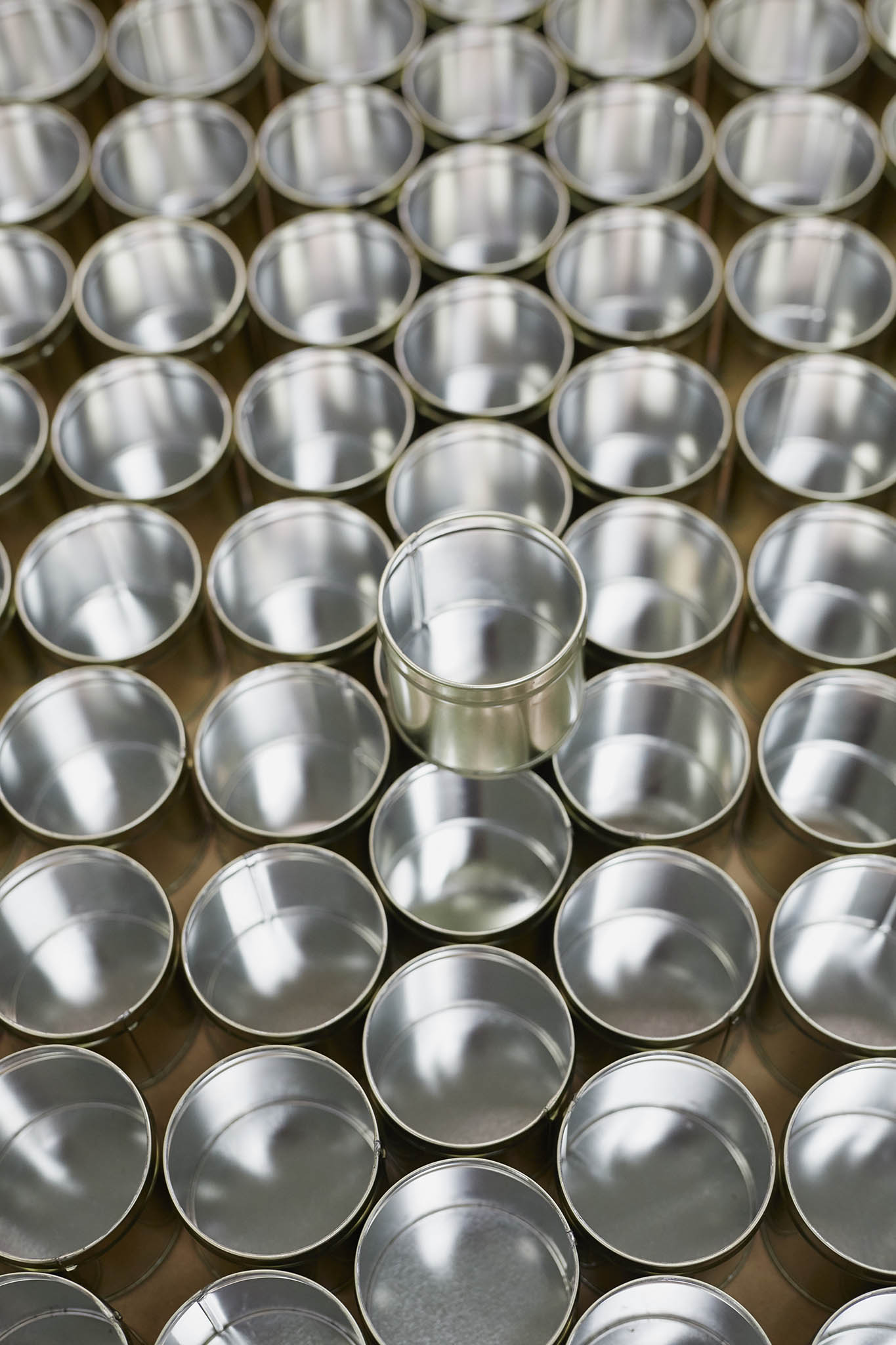 William Say & Co close up of many shiny cans on a table 
