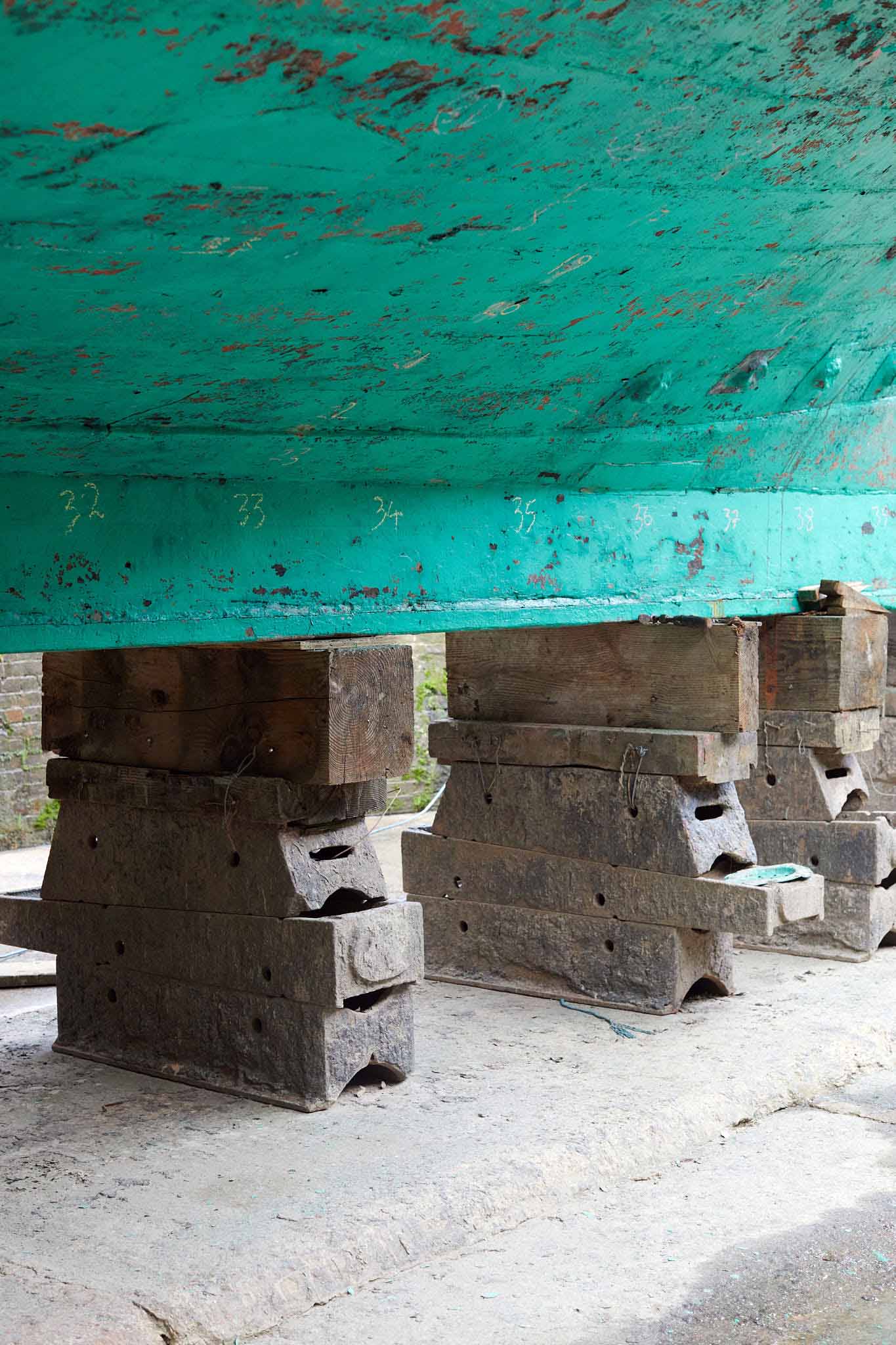 T Nielsen and Co ships hull propped up on metal stands 