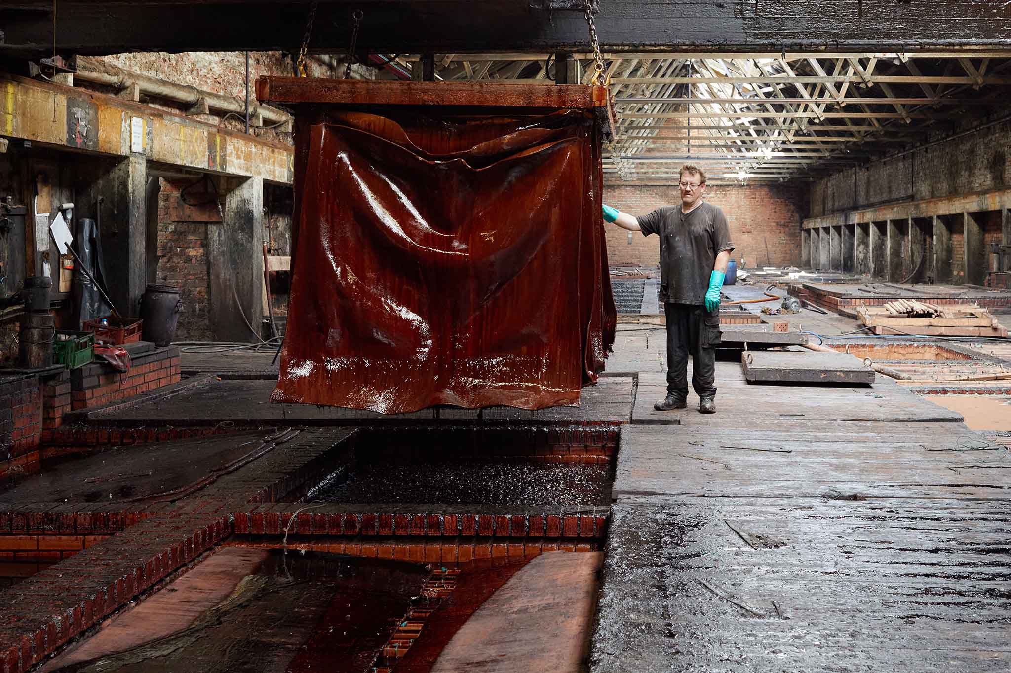 Thomas Ware and Sons pelts being removed  from tanning liquor inside tanning factory