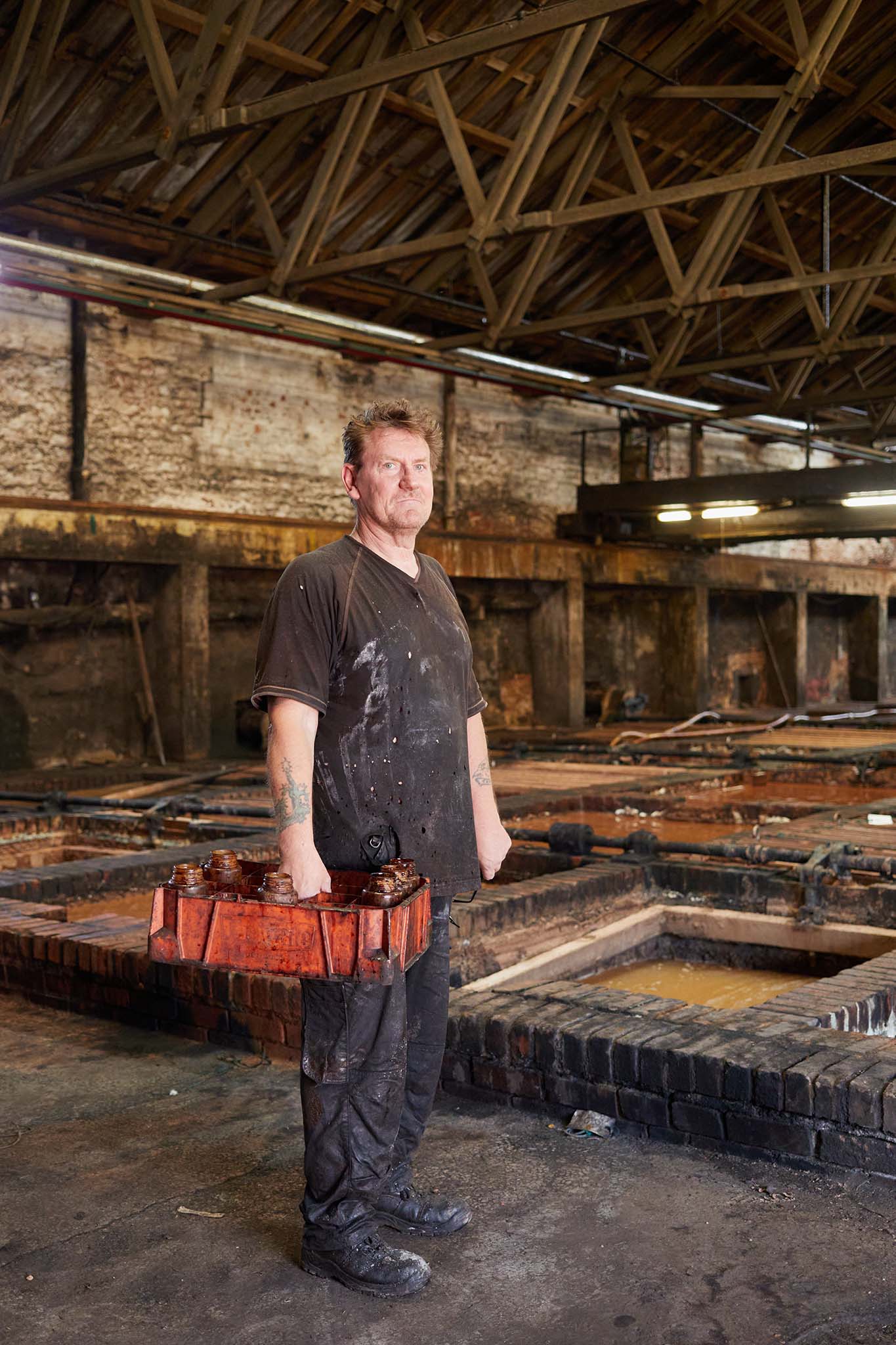 Thomas Ware and Sons leather worker in factory in front of water pits 