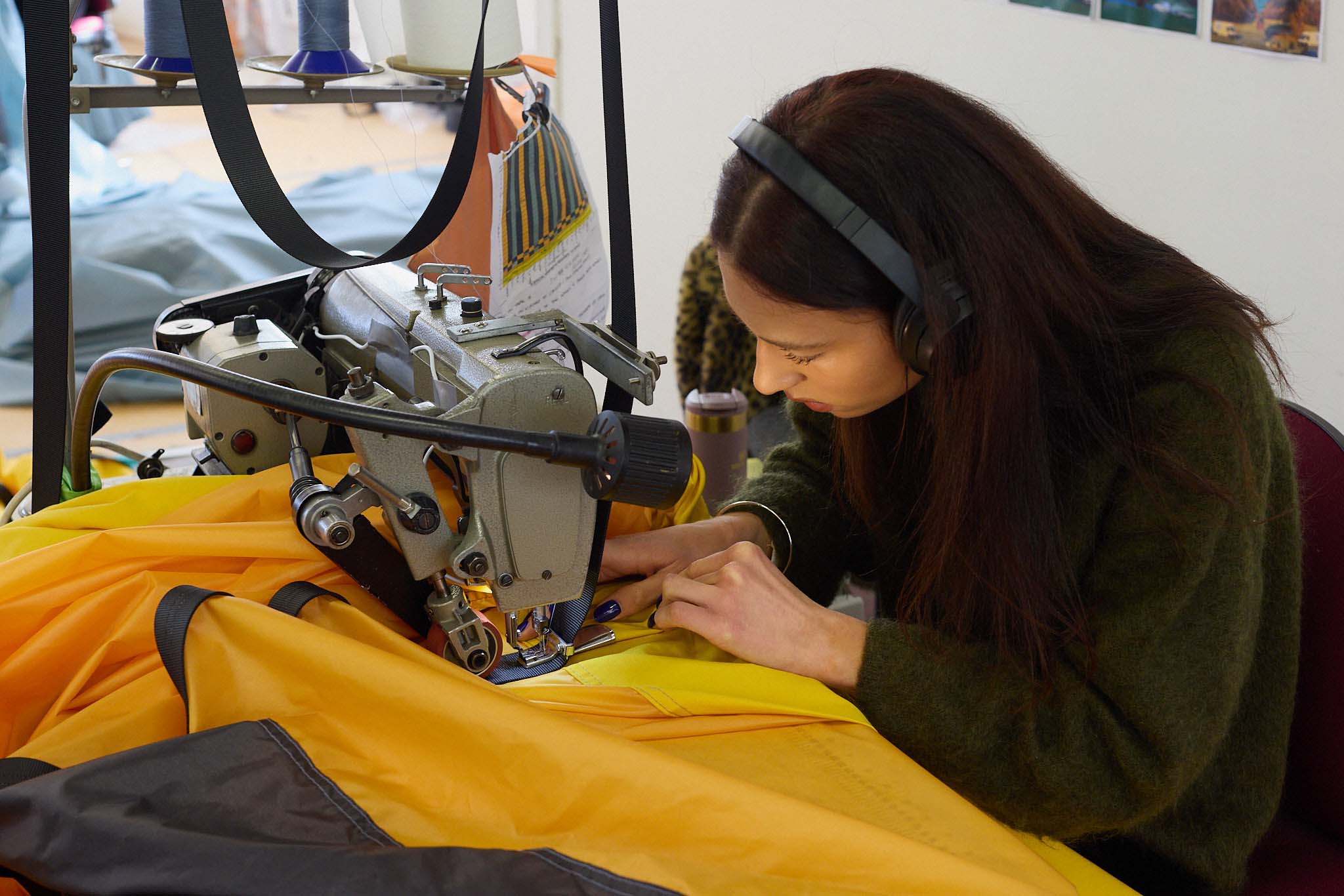 Cameron Balloons female seamstress working on yellow balloon 