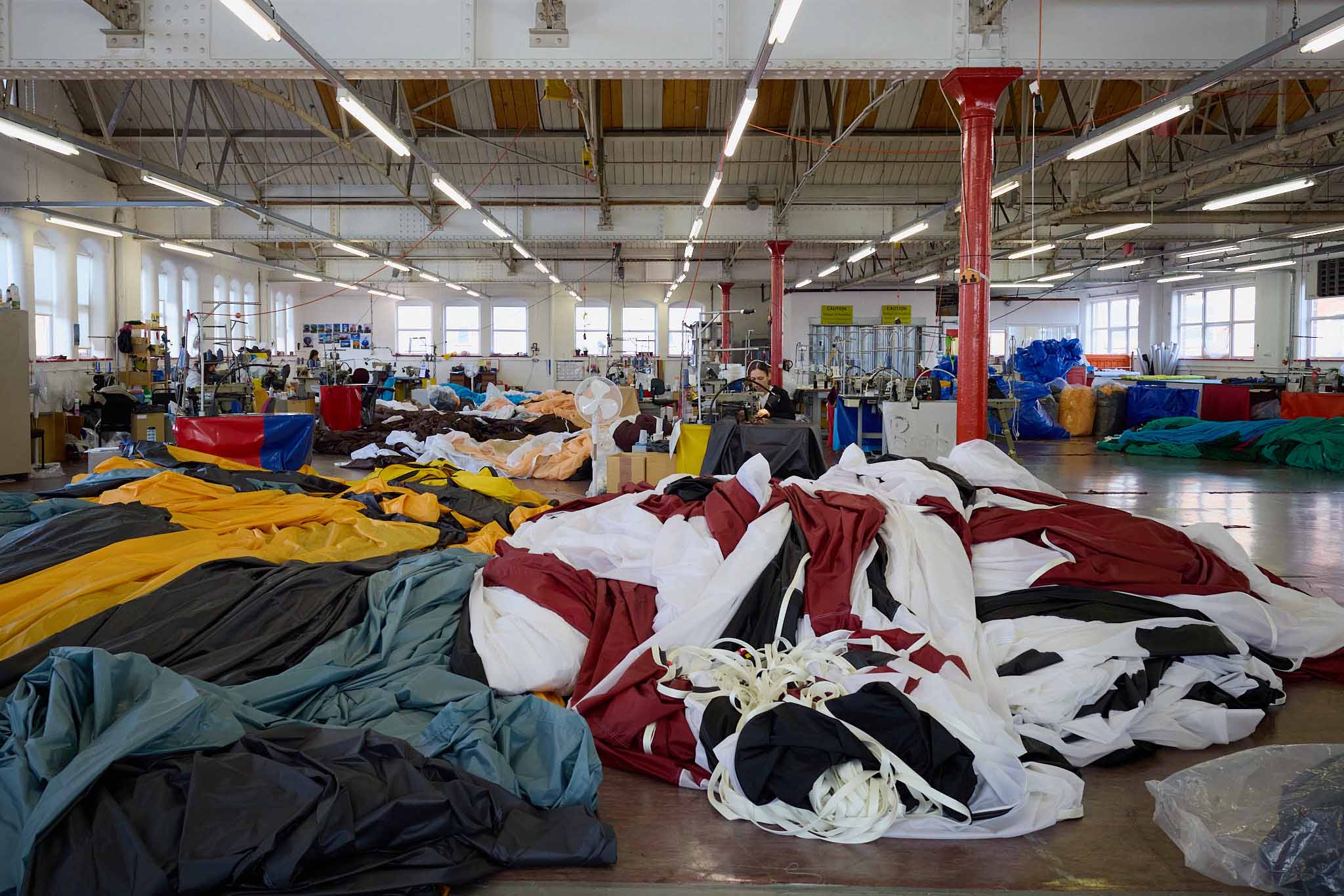 Cameron Balloons inside factory hot air balloon fabric covering floor