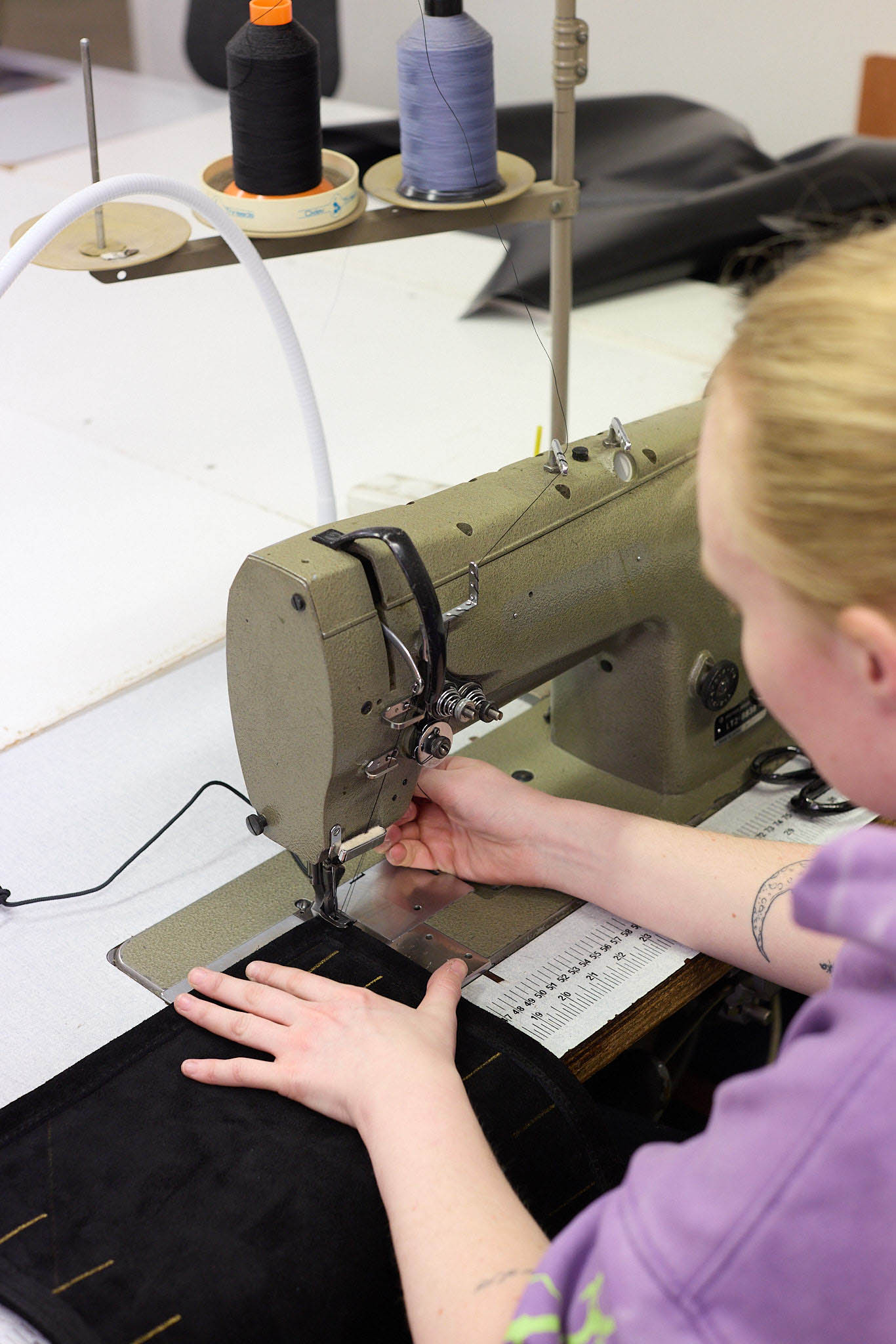 Cameron Balloons seamstress at sewing machine inside factory