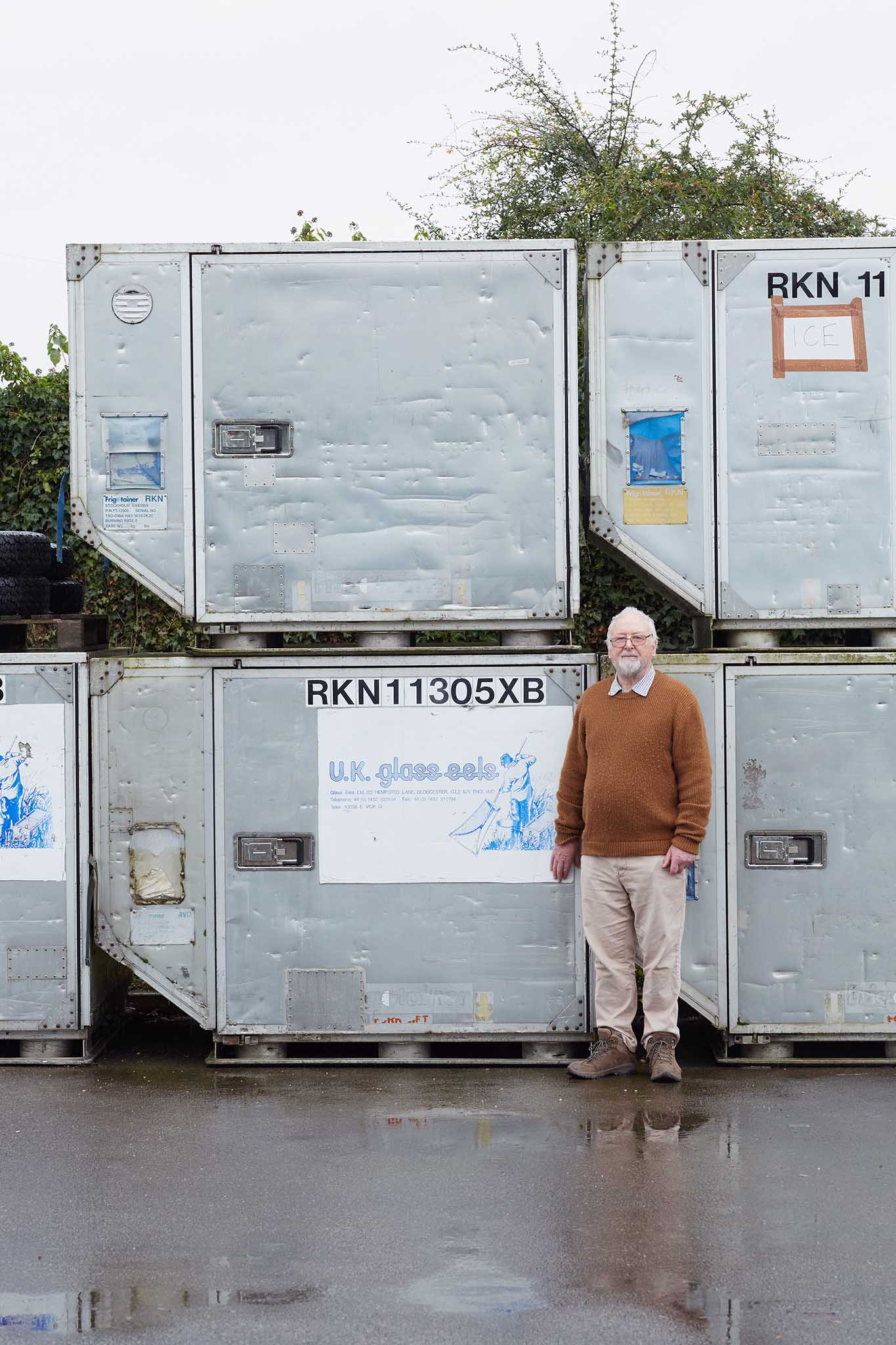 uk glass eels man standing outside wet floor in front of units