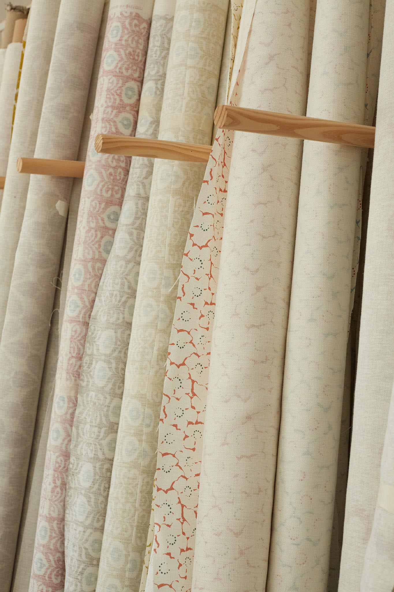 Rapture and Wright rolls of fabric light colours patterns
