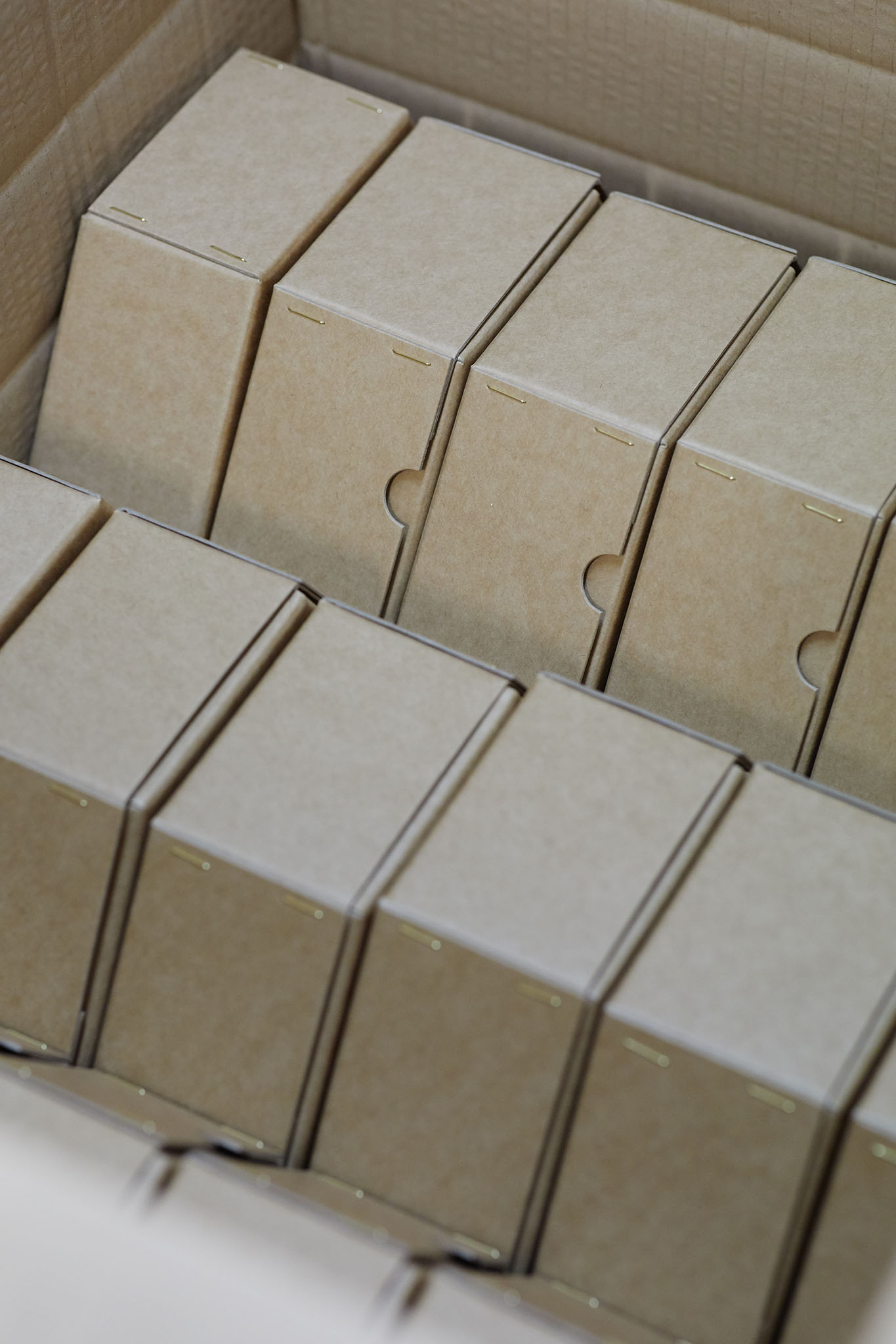 W MacCarthy & Sons container full of small carboard presentation boxes arranged on their side in rows