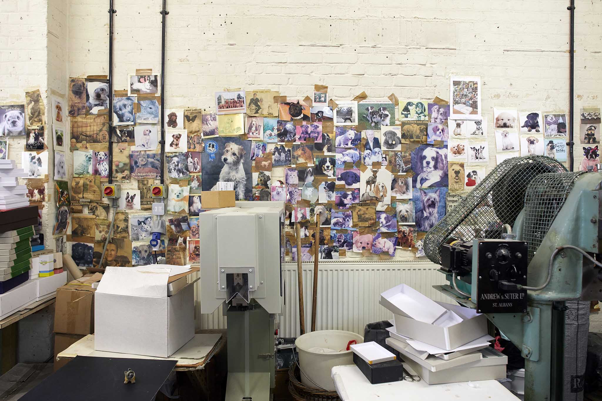W MacCarthy & Sons  factory office with pictures pasted on white brick walls