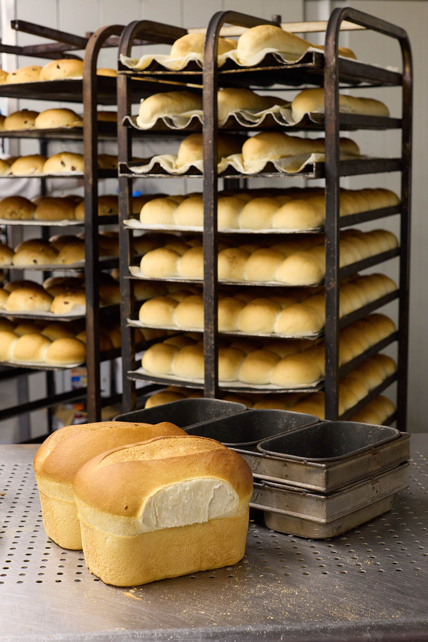 Janes Pantry tall trolley with multiple shelves full of loaves of bread baguette