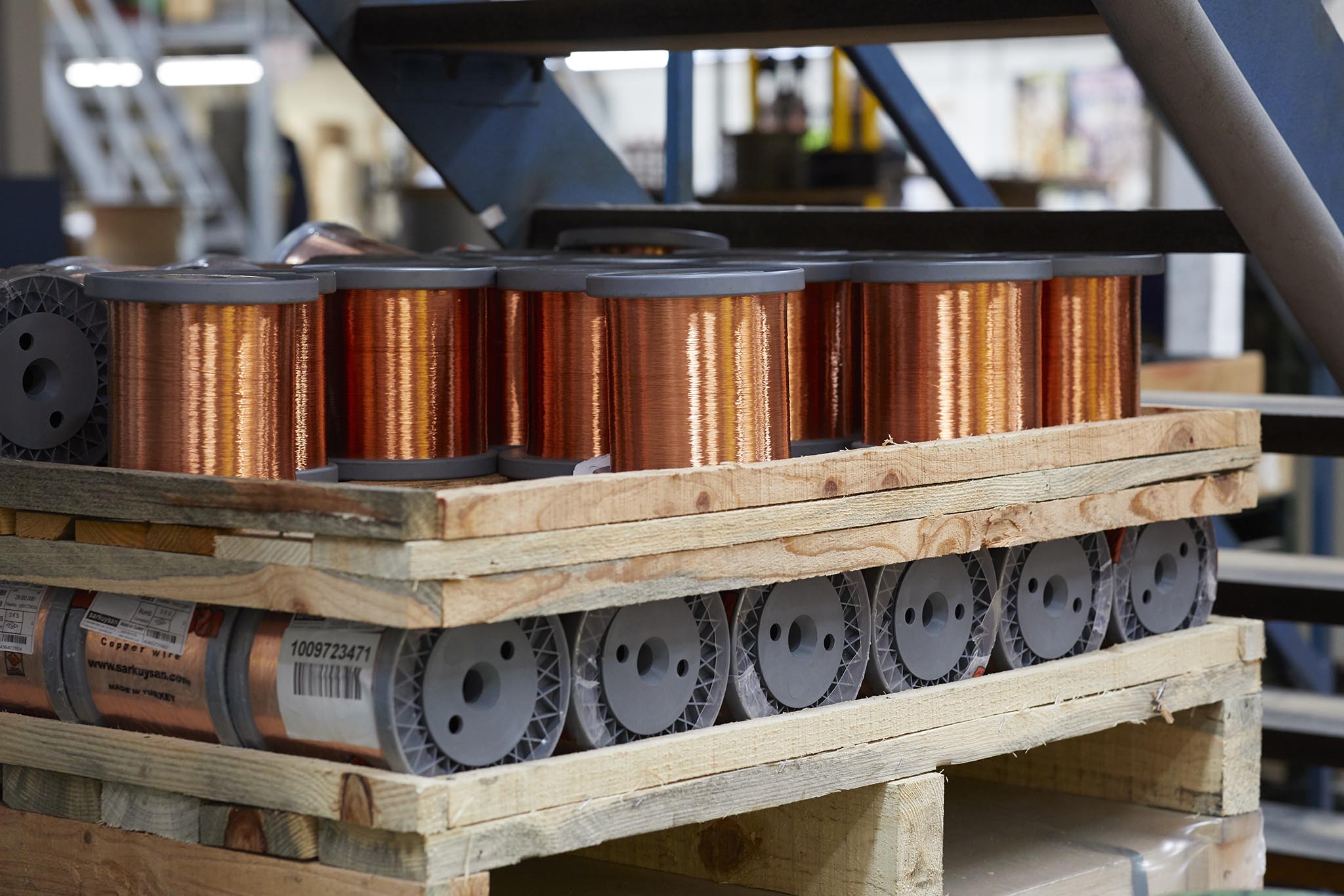 Ormiston Wire rolls of copper metal wire on wooden pallets