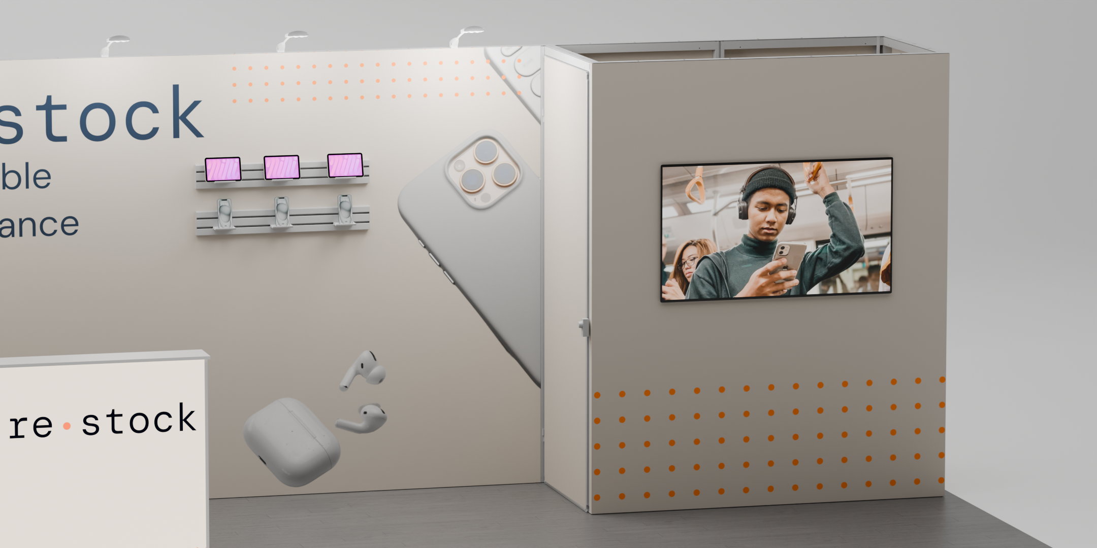 A close-up of a trade-show display with a large monitor as well as phones and tablets mounted on a slatwall panel.