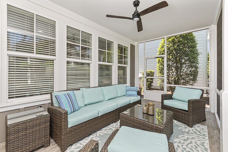 Indoor resort pool area with a lazy river, hot tub, giant checkers board, Connect Four game, and large windows at a North Myrtle Beach vacation rental.