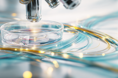 An overhead, close-up photograph capturing a modern, cordless chrome and polished white optical microscope, set within a pristine, light, and airy lightroom environment with specular reflections.