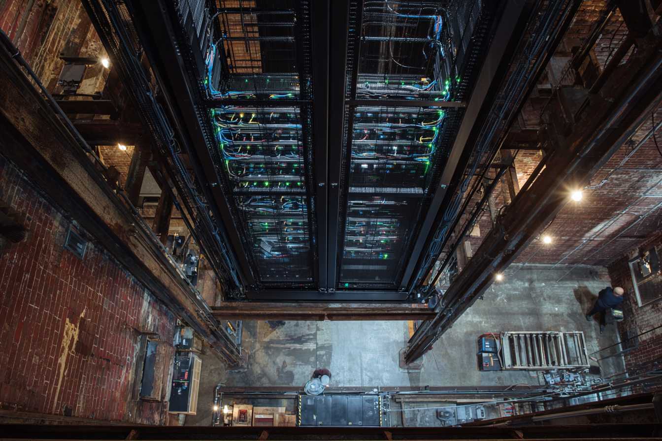 Modern server racks in an old brick factory building